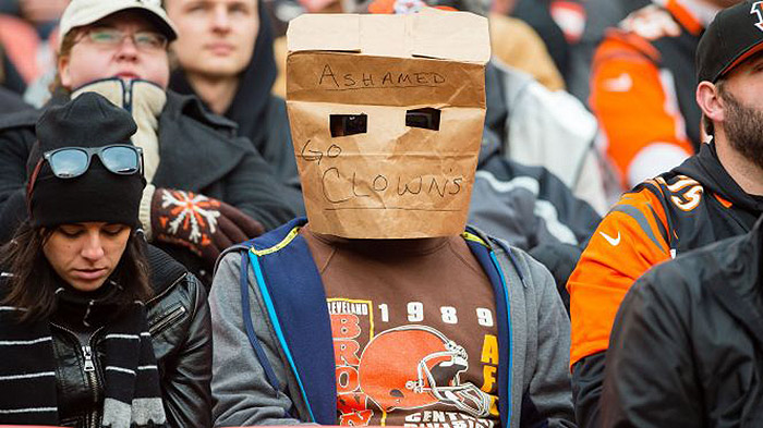 cleveland browns fan wears paper bag over his head while ashamed of his team